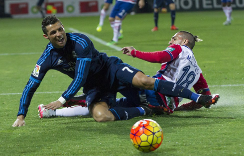 Cristiano Ronaldo gets tackled by Miguel Lopes