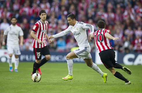 Cristiano Ronaldo runs past an Athletic Bilbao player, in a league fixture played at the new San Mamés stadium