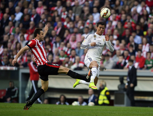 Cristiano Ronaldo gets tackled after reaching to the ball first, in Athletic Bilbao vs Real Madrid