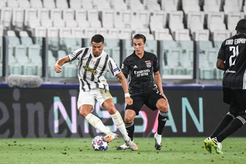 Cristiano Ronaldo guarding the ball from an opponent