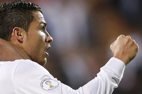 Cristiano Ronaldo raises his right fist, celebrating his Portugal goal against Luxembourg in the 2014 FIFA World Cup qualifiers