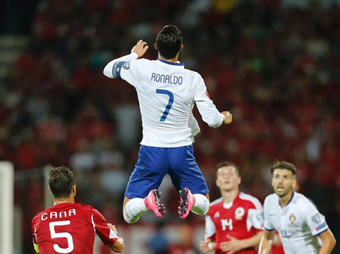 Cristiano Ronaldo jumping high in the air, in Albania vs Portugal