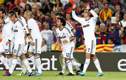 Cristiano Ronaldo claw celebration after scoring a goal against Barcelona, as he walks back with the rest of Real Madrid teammates, in 2012-2013