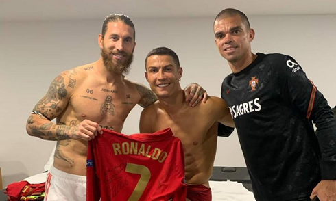 Sérgio Ramos, Cristiano Ronaldo and Pepe pose for a photo after the match between Portugal and Spain