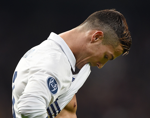 Cristiano Ronaldo biting his shirt in a Champions League game