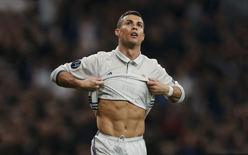 Cristiano Ronaldo pulling his shirt up and showing his abs