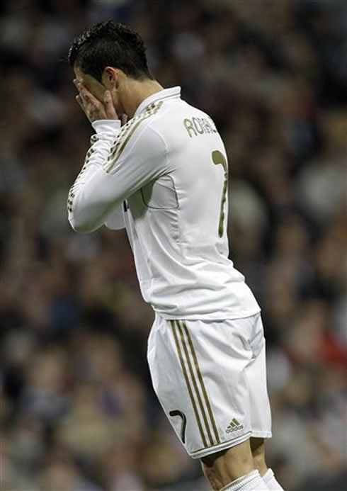 Cristiano Ronaldo covering his face while crying in Real Madrid 2012