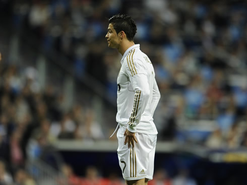 Cristiano Ronaldo with his hands on his hips, looking ahead, but upset