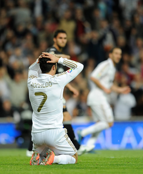 Cristiano Ronaldo puts his hands on his head, after Real Madrid fails to score against Valencia, in La Liga 2012