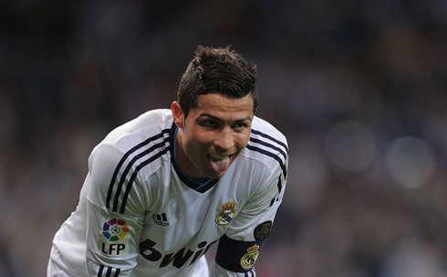Cristiano Ronaldo sticks his tongue out and puts on a funny face during a Real Madrid game in 2013
