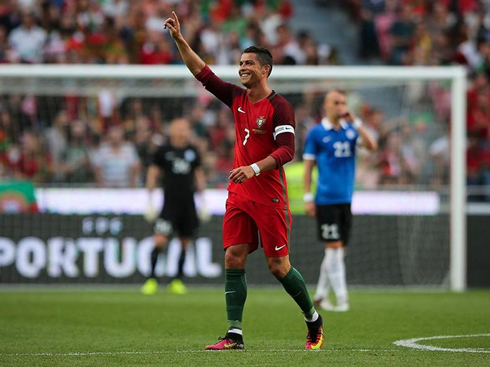 Cristiano Ronaldo raises his right hand to dedicate his goal for Portugal in a friendly ahead of the EURO 2016