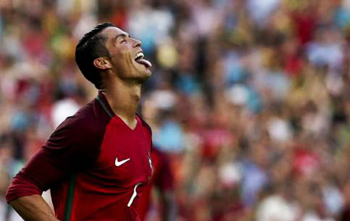 Cristiano Ronaldo putting his tongue out and smiling