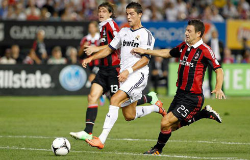 Cristiano Ronaldo breaching into AC Milan's defense, in Real Madrid pre-season tour at the United States in 2012-13