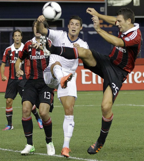 Cristiano Ronaldo fighting for the ball with an AC Milan defender, at the Yankees Stadium in New York, in 2012