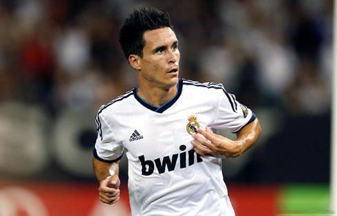 Callejón showing his neverending love for Real Madrid, by pointing to the club's badge, during the pre-season in 2012-2013