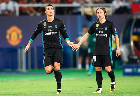 Cristiano Ronaldo tapping Modric hand as he comes on to play a few minutes against Manchester United