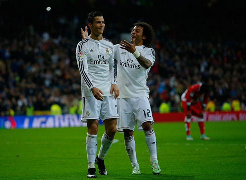 Cristiano Ronaldo smiling after scoring, next to Marcelo