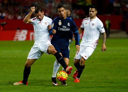 Cristiano Ronaldo being pushed away from the ball, in Sevilla vs Real Madrid in 2015