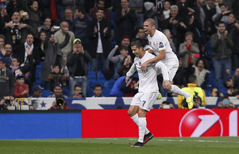 Cristiano Ronaldo piggy backing Pepe after scoring for Real Madrid in December of 2015