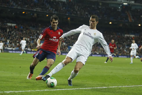 Cristiano Ronaldo controlling the ball before it crosses the sideline