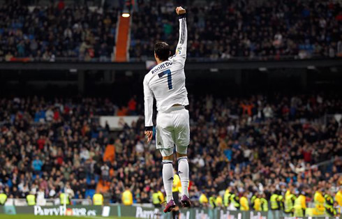 Cristiano Ronaldo jumping in goal celebration in Real Madrid 2013