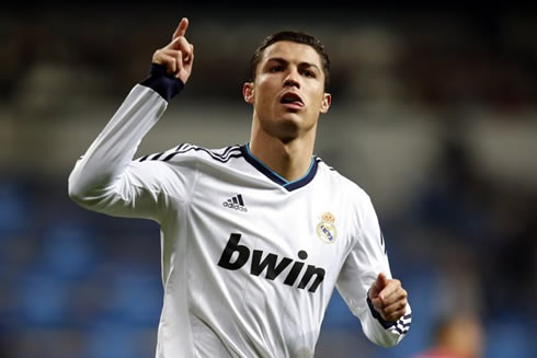 Cristiano Ronaldo raising his finger and putting his tongue out, in Real Madrid 2013