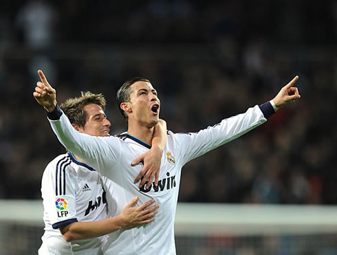 Cristiano Ronaldo stretching his two arms and showing his joy face after a goal, in Real Madrid 4-1 Sevilla, in 2013