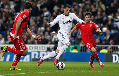 Cristiano Ronaldo breaching into Sevilla's defence, in a game for La Liga in 2013