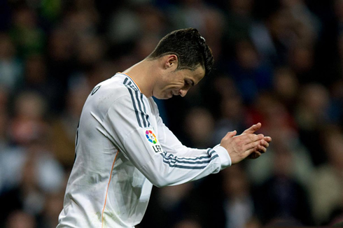 Cristiano Ronaldo applauding the referee's decision during a game for Real Madrid