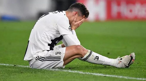 Cristiano Ronaldo cries on the ground