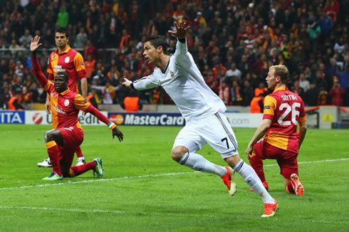 Cristiano Ronaldo stretches his arms to celebrate Real Madrid's first goal in Istanbul against Galatasaray, in the Champions League knock-out stages in 2013