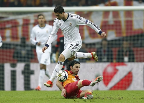 Cristiano Ronaldo jumping over a Galatasaray player sliding tackle, in a Real Madrid Champions League night, in 2013