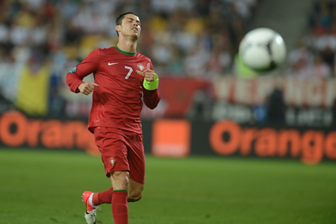 Cristiano Ronaldo closing his eyes while chasing a ball in Portugal vs Germany, for the EURO 2012
