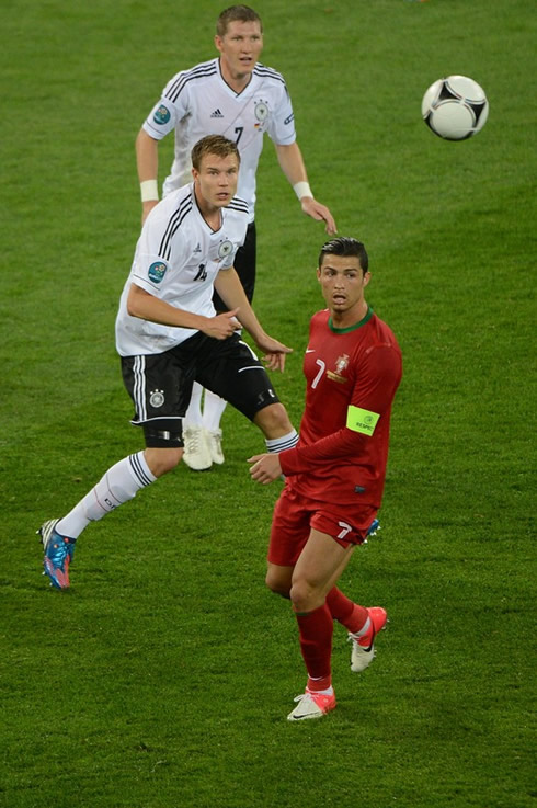 Cristiano Ronaldo near two German players in the EURO 2012