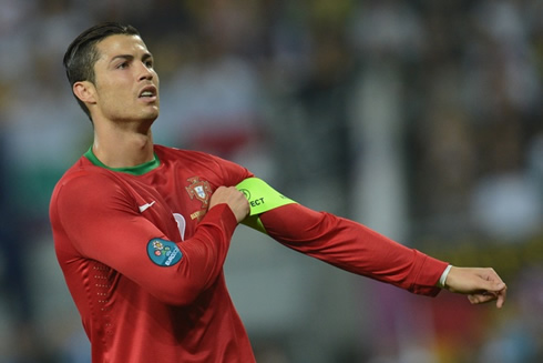 Cristiano Ronaldo touching the Portuguese captain armband and the FIFA 'Respect' message, in the EURO 2012
