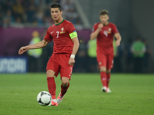 Cristiano Ronaldo passing the ball in a Portugal game for the EURO 2012