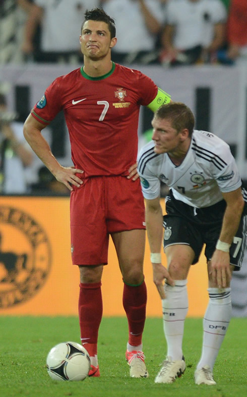 Cristiano Ronaldo making a funny face with Bastian Schweinsteiger near him, in the EURO 2012