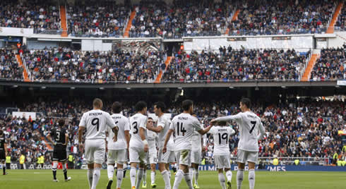 Real Madrid team players heading back to their own half after another Ronaldo goal