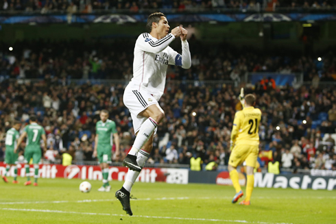 Cristiano Ronaldo jumps in the air to celebrate his opening goal for Real Madrid in the Champions League 2014-2015