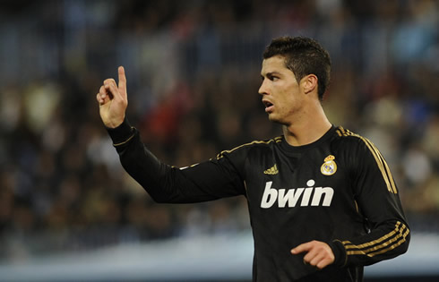 
Cristiano Ronaldo swings his finger sideways, telling the referee he has made a mistake
