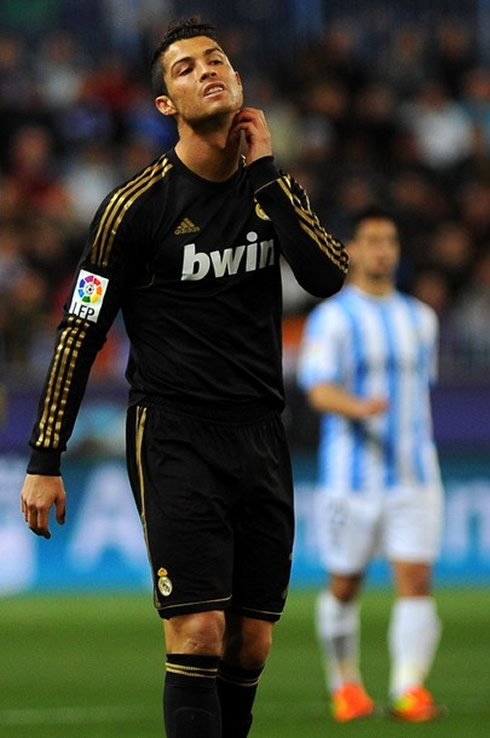 Cristiano Ronaldo scratching his neck in a Real Madrid game against Malaga in 2012