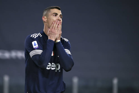 Cristiano Ronaldo covering his mouth with his hands