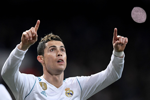 Cristiano Ronaldo pointing his two fingers up top