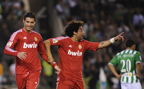 Cristiano Ronaldo running with Marcelo, as both prepare for another dancing celebration in Real Madrid 2012