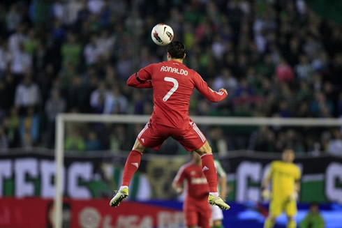 Cristiano Ronaldo jumping alone in the air and heading the ball