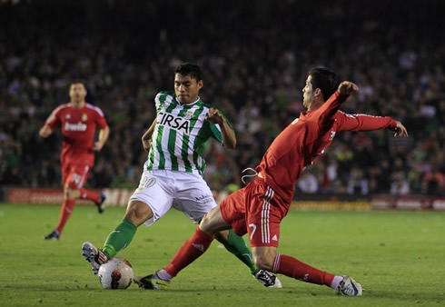 Cristiano Ronaldo stretching his right leg to steal the ball for Real Madrid