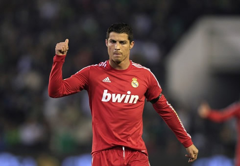 Cristiano Ronaldo gives an OK sign to his teammate, after a bad pass was made