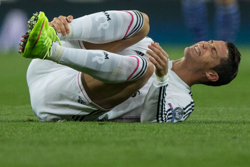 Cristiano Ronaldo goes to the ground after getting hurt in his ankle