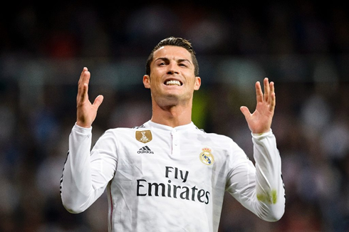 Cristiano Ronaldo smiling with frustration after missing a good chance for Real Madrid