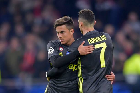 Paulo Dybala and Cristiano Ronaldo hugging each other